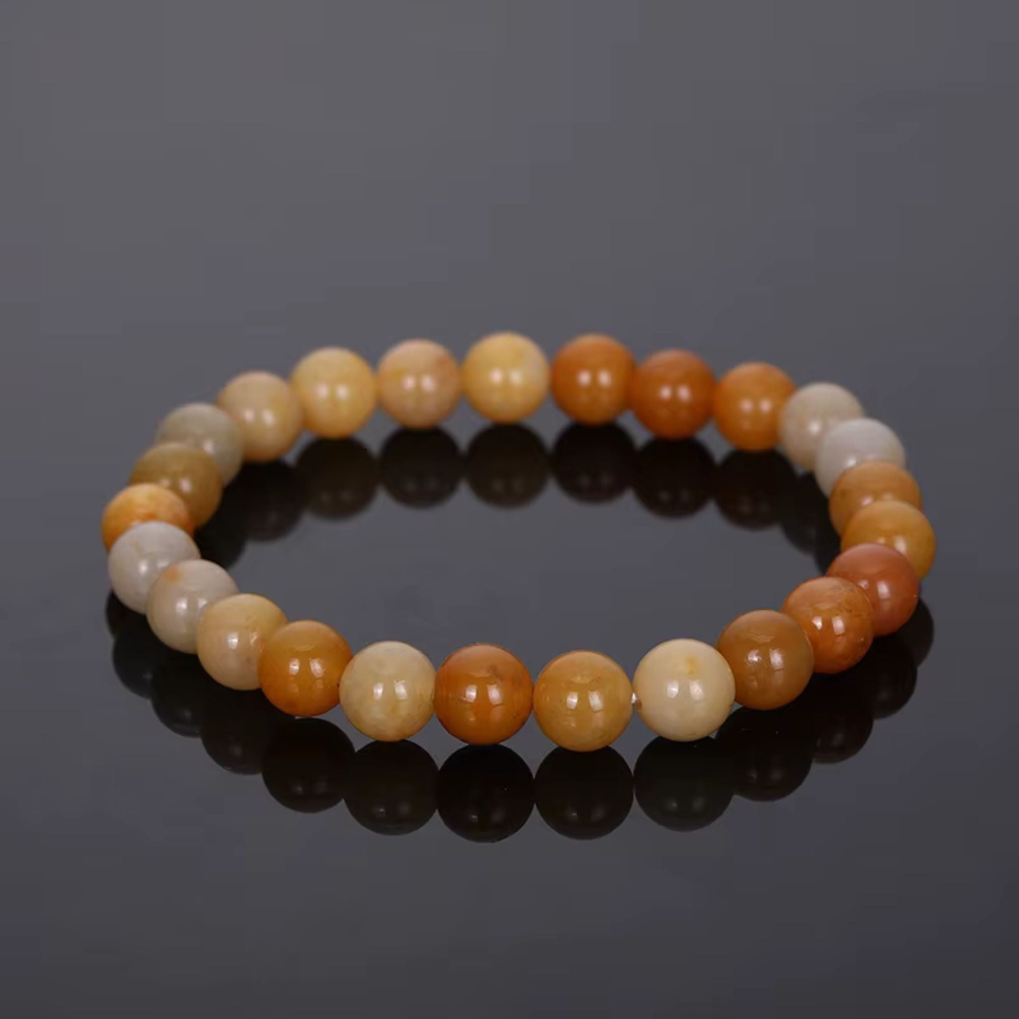 Bracelet en perles synthétiques aventurine. Orange, miel et crème. Bijou élégant. S'adapte à tous les poignets. Élastique ajustable