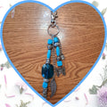 Porte-clé Turquoise Papillon et Plume - Fait Main - Art & Trésorts